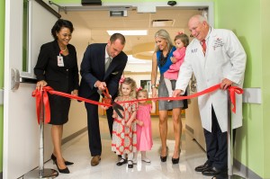 NFL quarterback Matt Schaub, wife Laurie, and three children cut the ribbon on newly expanded GR8 Hope Foundation Emergency Care Area.