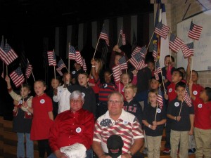 First graders from Primrose of Kelliwood give respect to a few honored veterans.