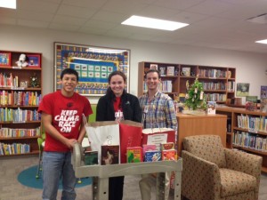 Pictured are Philip Garza and Caroline Benson, with Brian Ballard, Library Coordinator for the Texas Children’s Hospital.